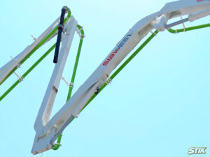 Concrete pump with custom equipment decals and company branding in Toronto