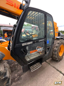 JCB Loadall telehandler with branded decals and company logo applied