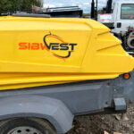 Portable air compressor with custom branding decals and contact information