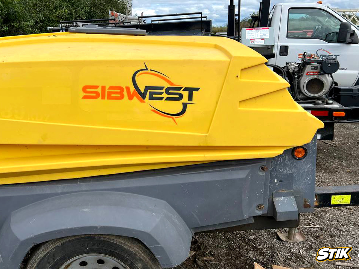 Portable air compressor with custom branding decals and contact information