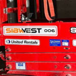 Scissor lift with professional equipment decals and logo branding
