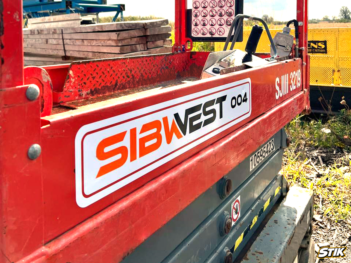 One more scissor lift with custom vinyl decals and company branding details