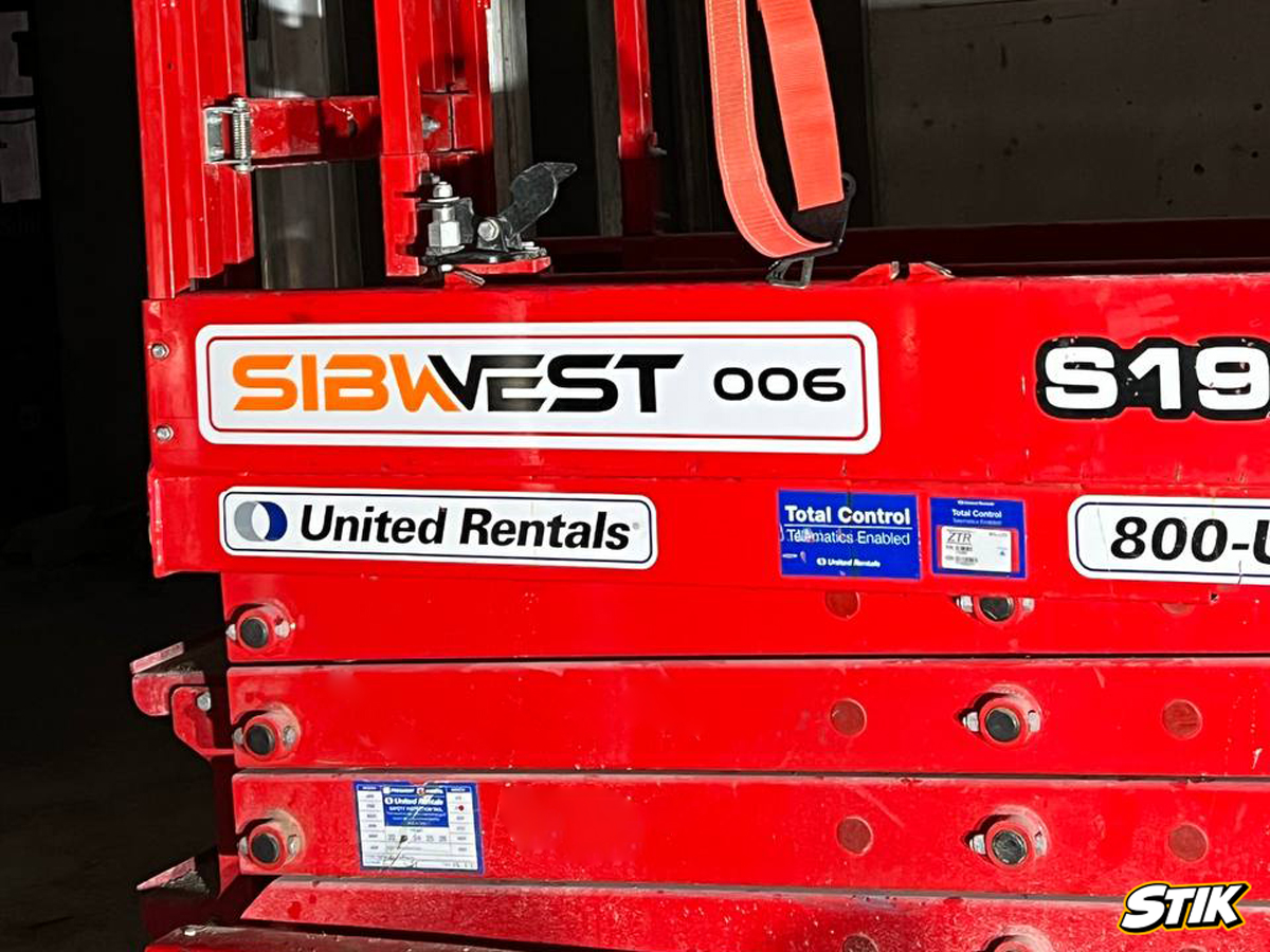 Scissor lift with professional equipment decals and logo branding