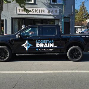 Contractor truck with logo and contact details applied using durable vinyl decals