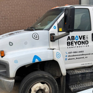 Work truck with vinyl decals and contact information