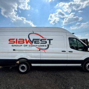 Branded construction van with company logo and lettering